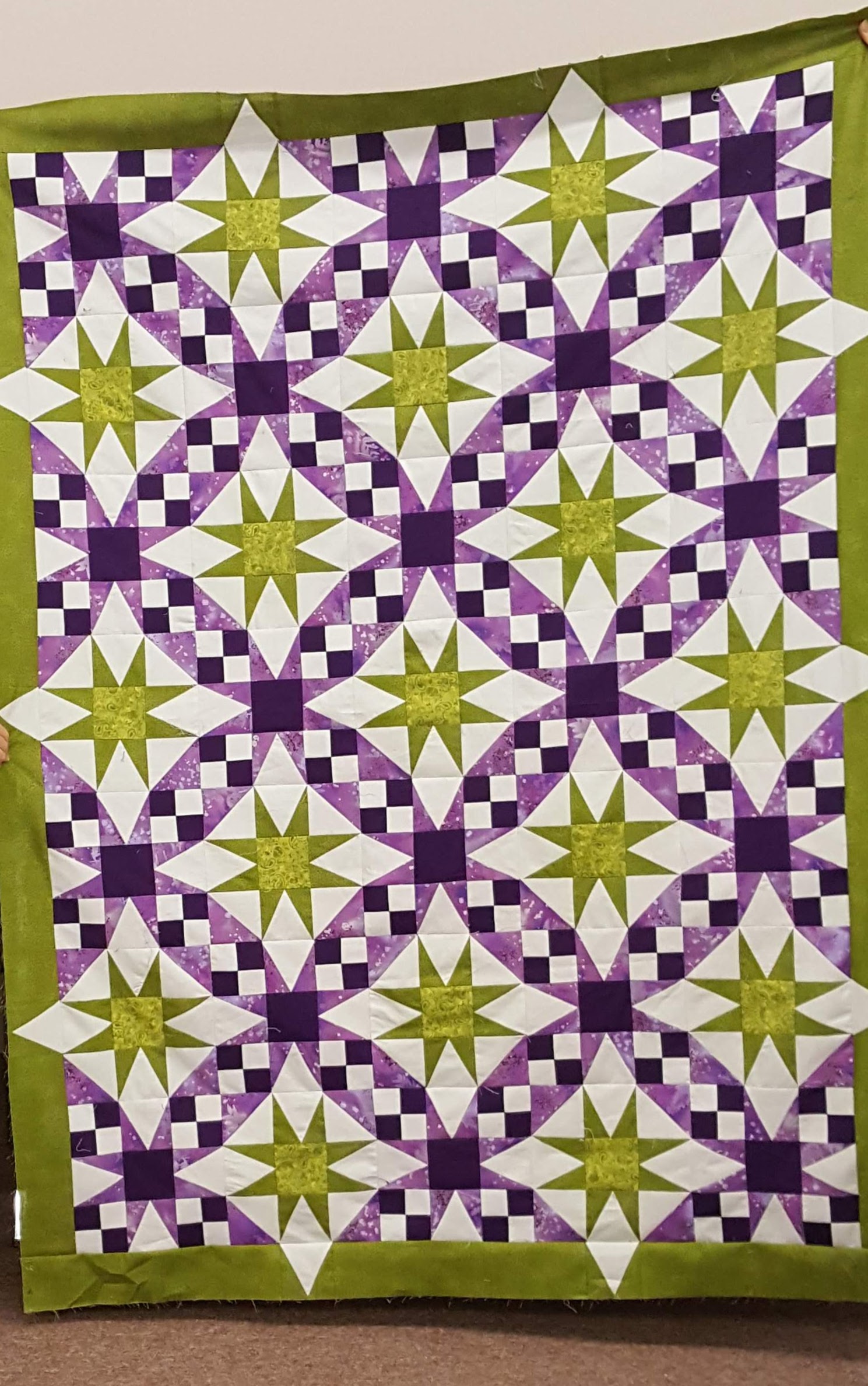 galaxy quilt in purple and green