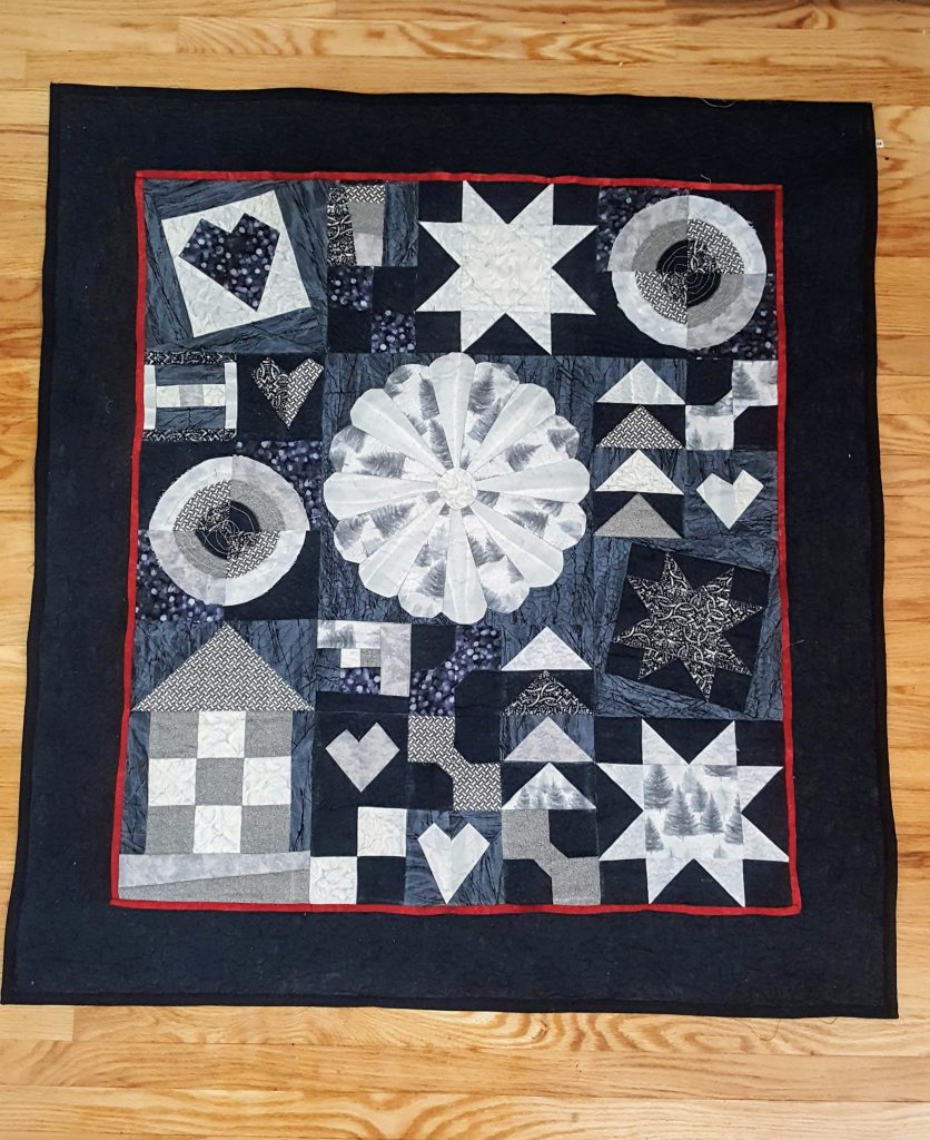 black and grey sampler quilt