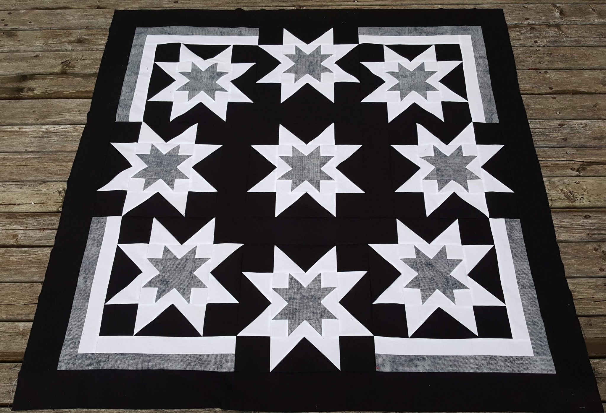 A modern baby quilt with high contrast colors Sew Yummy