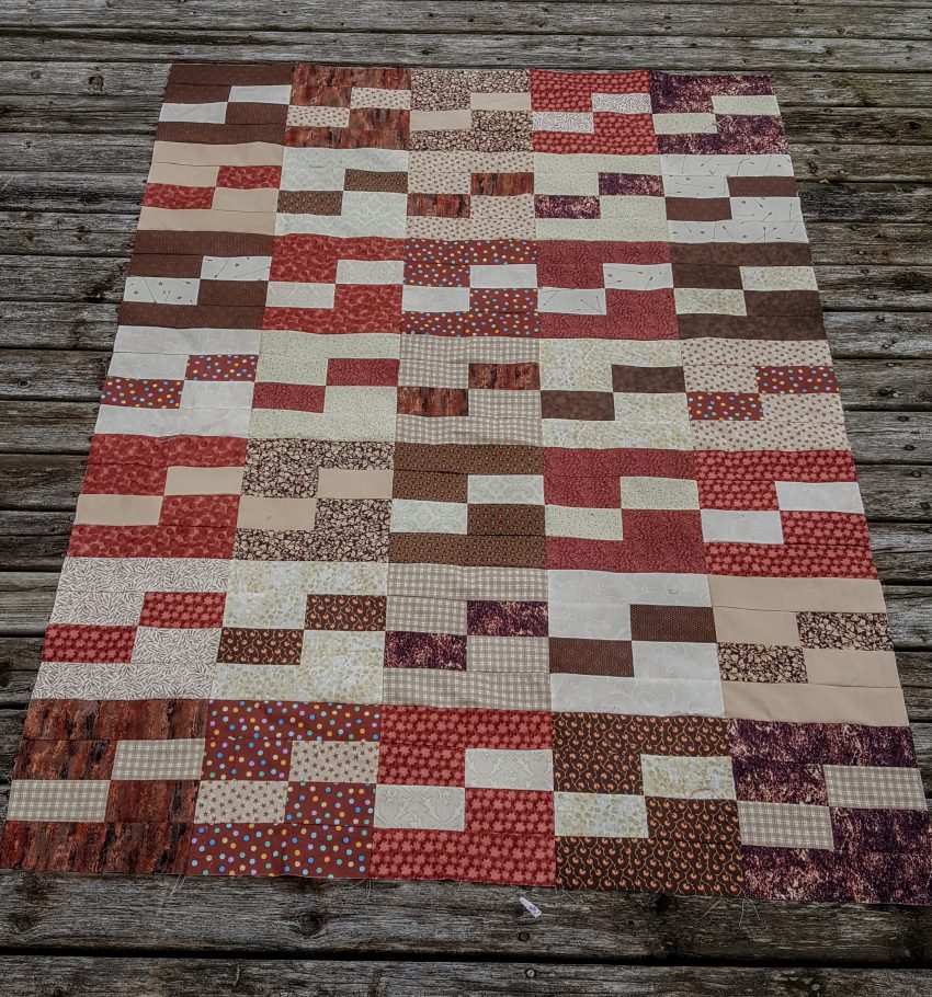 brown and beige quilt