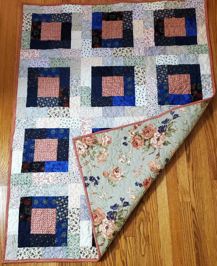 Potato chip block quilt showing the backing fabric